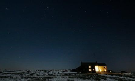 England’s highest pub, the Tan Hill inn, at night.