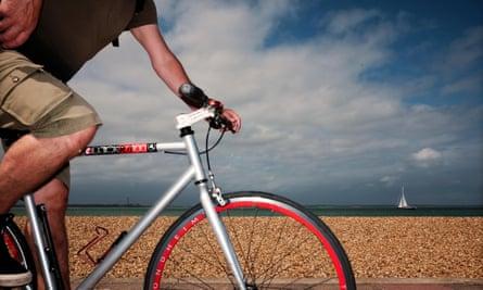A cyclist cycling along the promenade at Cowes seafront